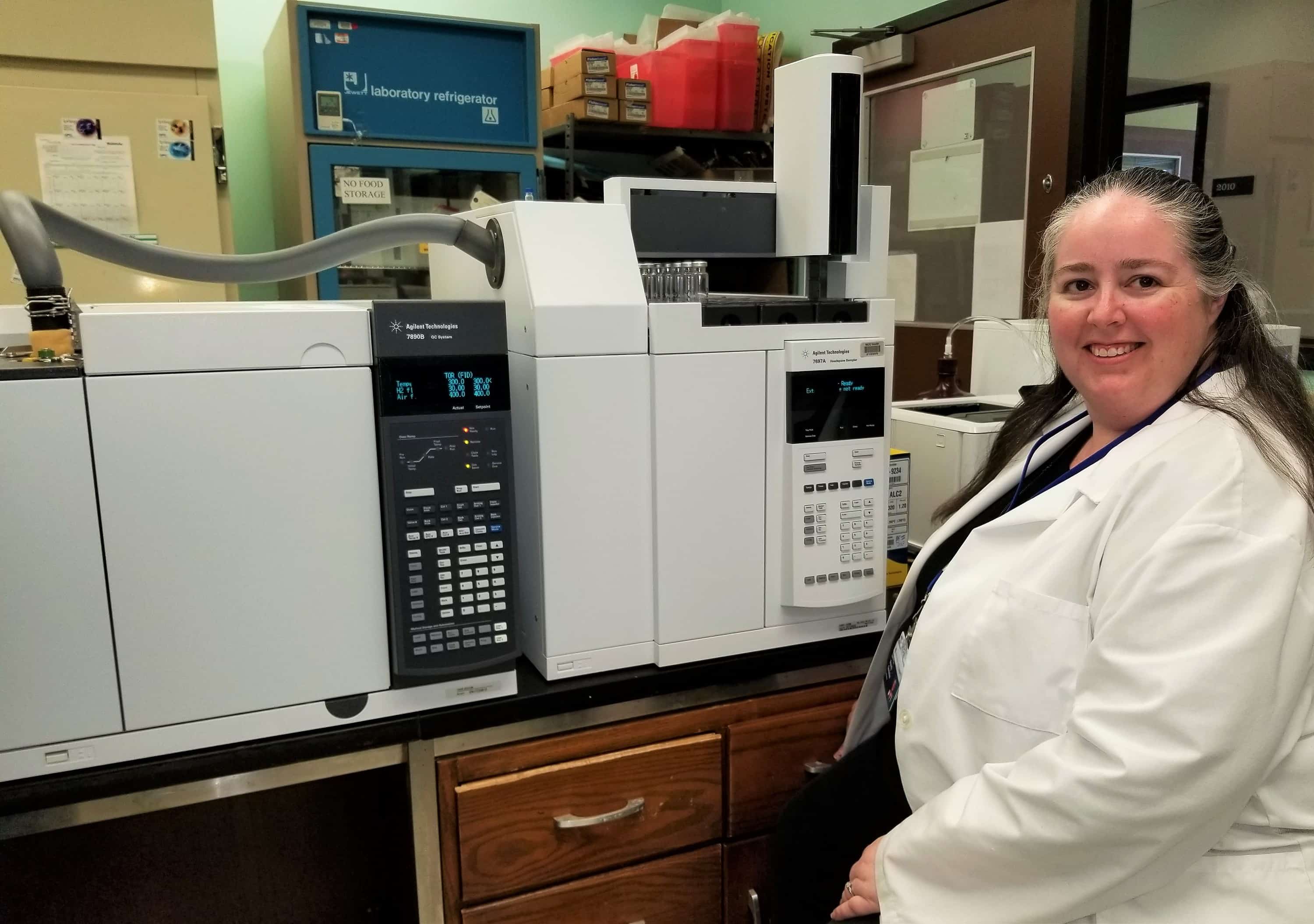 First DCLS graduate, Brandy Gunsolus in lab with equiptment