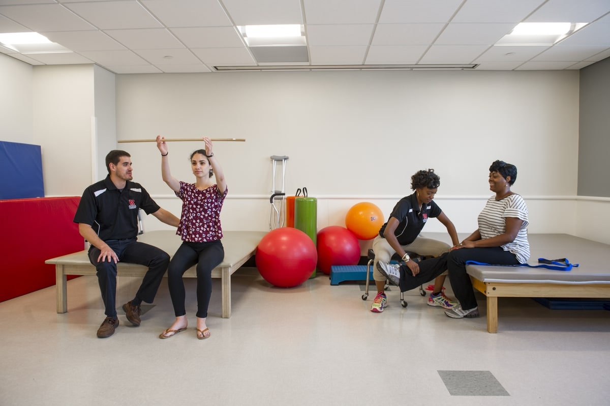 DPT students work with students practice on patients.