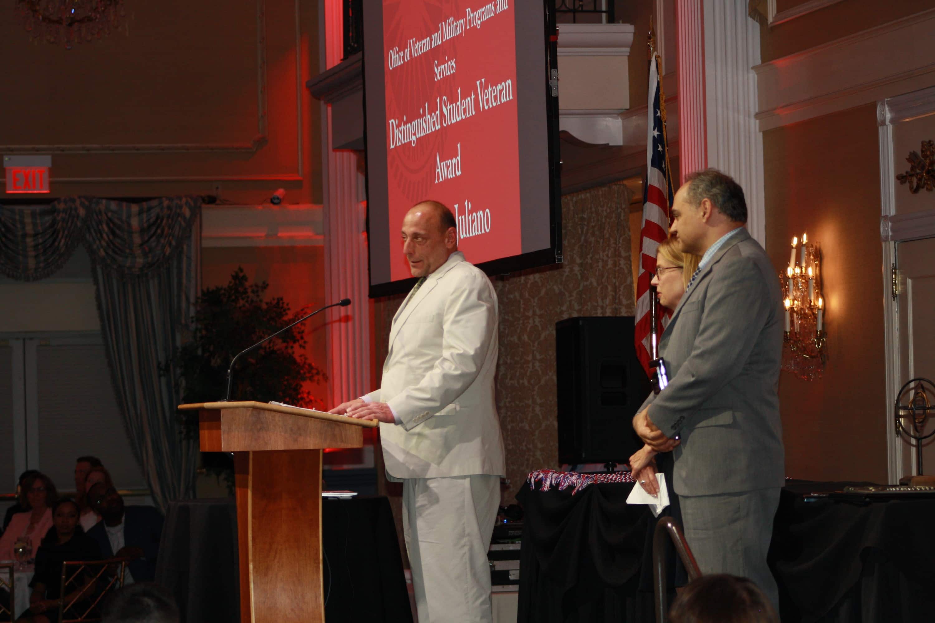 Anthony Juliana, a combat veteran and graduate, is recognized with an award. 