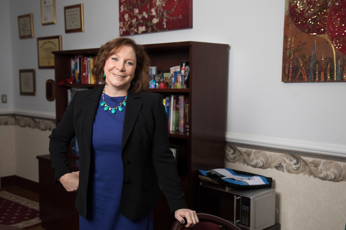 Dr. Barbara Gladson standing in office