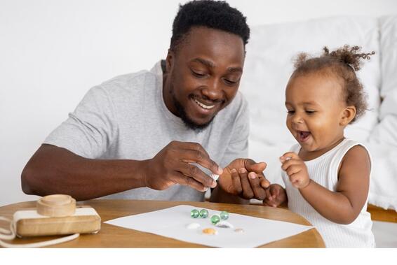 African American child with their parent/caregiver